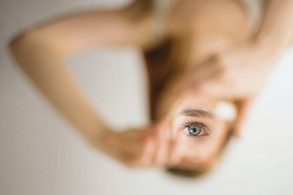 Blurred abstract image featuring a woman's eye positioned upside down in Paris.